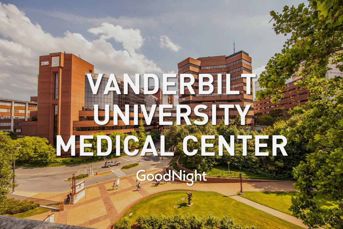 The main building of Vanderbilt University Medical Center is surrounded by landscaped green spaces and walkways. This anchors the narrative about proximity to leading institutions and underscores the convenience for business and medical travelers.