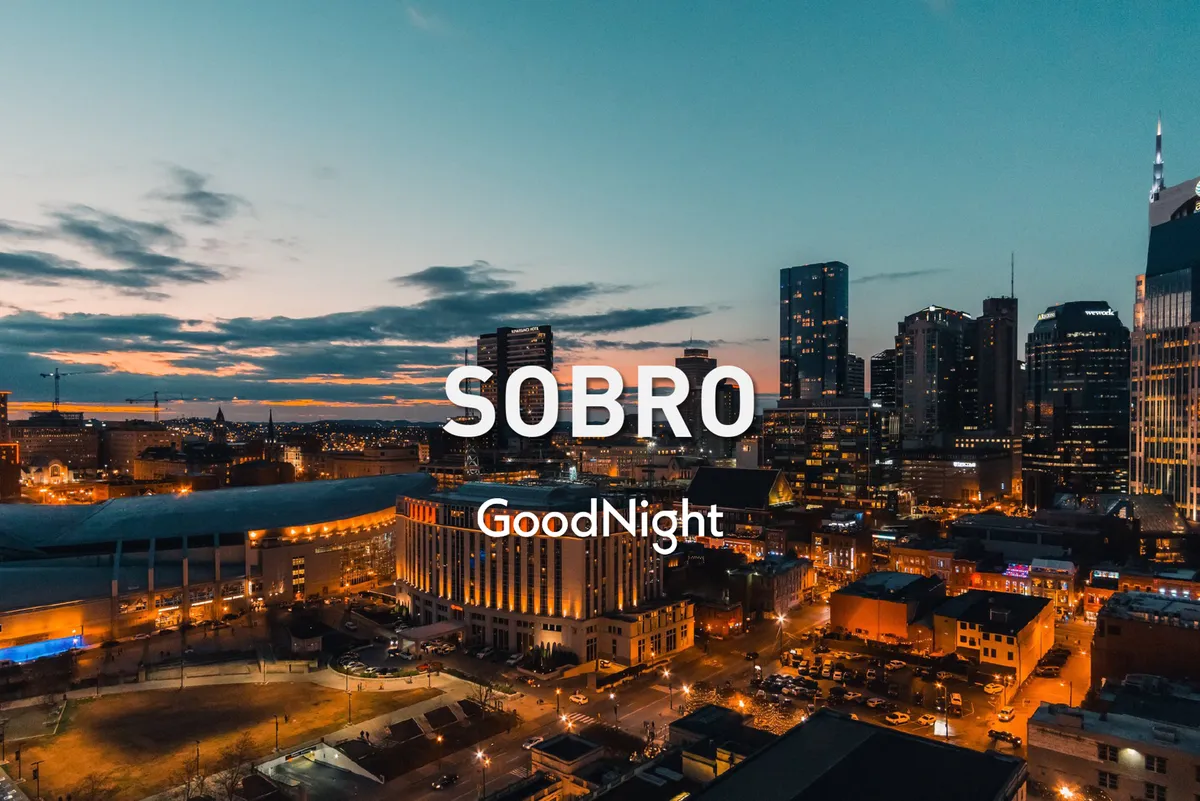 This view image offers a sweeping perspective of the city skyline under a vibrant sunset sky. The prominent buildings and glowing horizon suggest a stunning vantage point—much like what one might experience from a private rooftop deck during a memorable evening gathering.